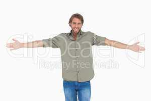 Smiling man with arms open wide