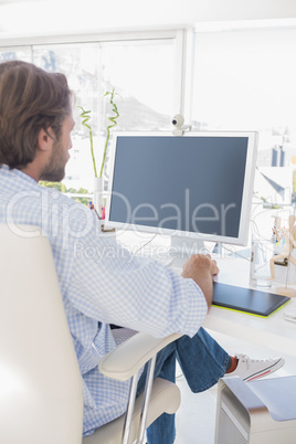 Designer sitting at desk and working