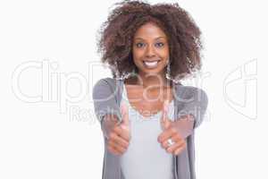 Happy woman giving thumbs up