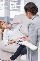 Woman lying on therapists couch looking up