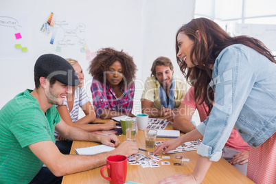 Editor picking photographs in a meeting