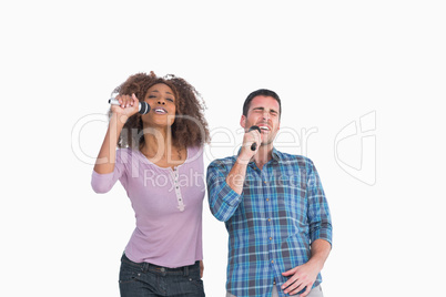 Fun pair singing at karaoke