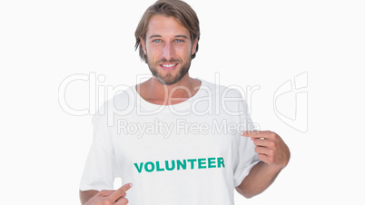 Man pointing to his volunteer tshirt