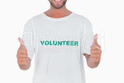 Man wearing volunteer tshirt giving thumbs up