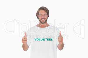 Happy man wearing volunteer tshirt giving thumbs up