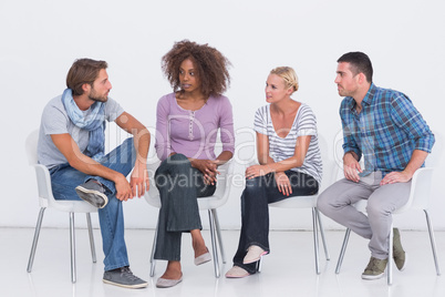 Stylish people sitting and chatting