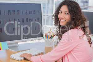 Smiling editor at her desk