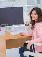 Happy woman working in creative office
