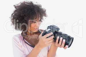 Smiling woman looking at digital camera