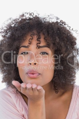 Beautiful woman blowing a kiss