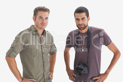 Photographer and his friend looking at camera