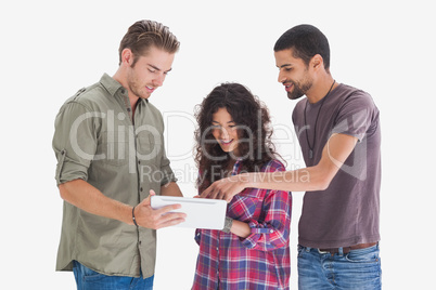 Stylish friends looking at tablet