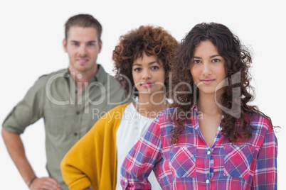 Three stylish friends standing in a line