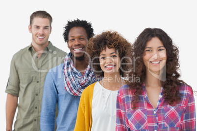 Four stylish friends standing in a row