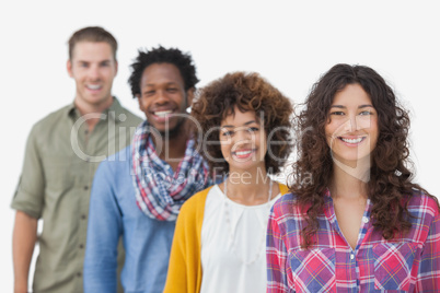 Four stylish friends standing in a line