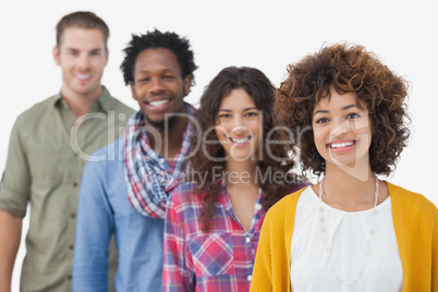 Four stylish friends smiling at camera