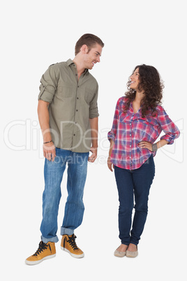 Two stylish friends smiling at the each other Two stylish friends smiling at the each other