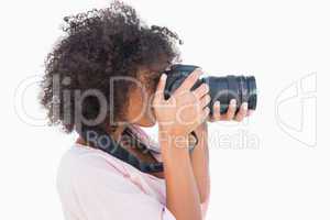 Woman with afro taking a photo