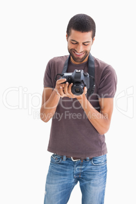 Stylish man with camera around his neck