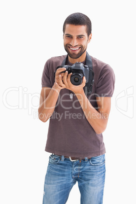 Cheerful man with camera around his neck