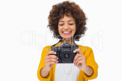 Attractive girl holding a camera