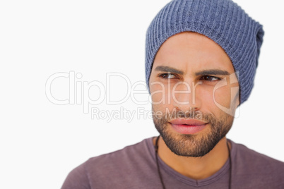 Thoughtful man wearing beanie hat