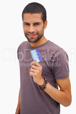 Happy man holding credit card