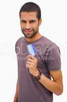 Happy man holding credit card