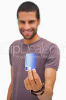 Smiling man holding credit card