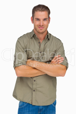 Man smiling with arms crossed
