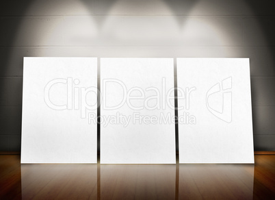 Three posters standing in line
