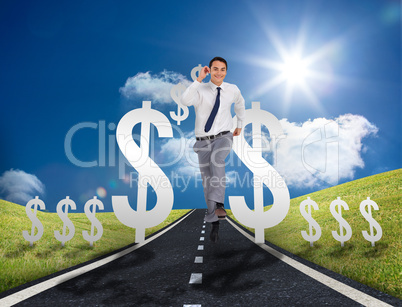 Businessman running on a road with dollar signs