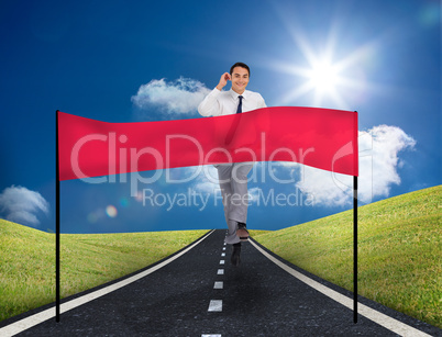 Smiling young businessman running on a road with copy space bann