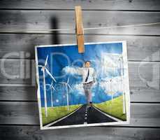 Photo of businessman running on a road hung on a line