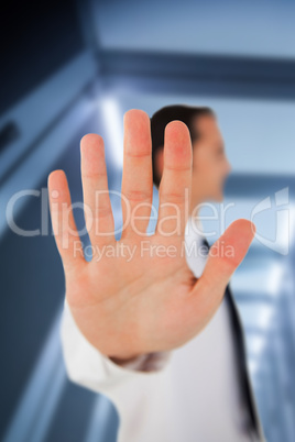 Businessman placing his hand on clear surface