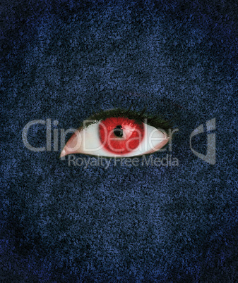 Red eye over blue texture
