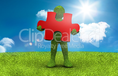 Green character holding a red jigsaw piece