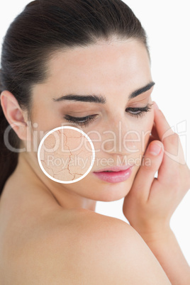 Woman rubbing her skin with close up of her wrinkles