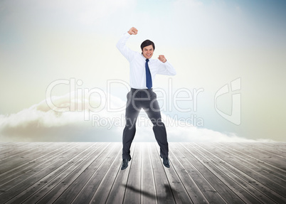 Businessman jumping over wooden boards