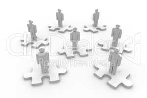 Strewn human representation standing on jigsaw pieces