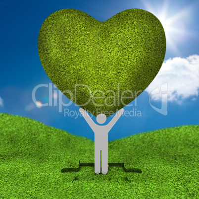 Human representation holding a big green heart