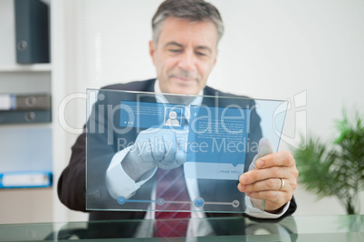 Businessman using futuristic touchscreen to view social media pr