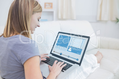 Woman sitting on couch and checking social media profile