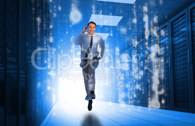 Businessman running through data center