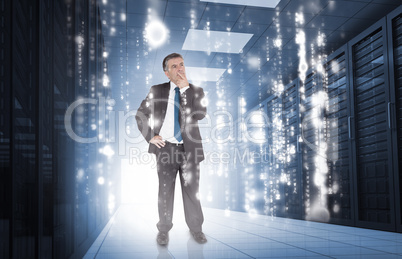 Businessman thinking in data center