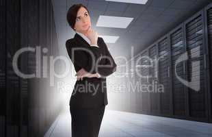 Businesswoman looking thoughtful in data center