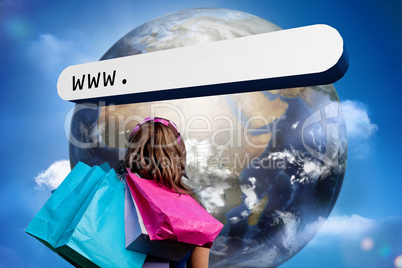 Girl with shopping bags looking at address bar with large earth