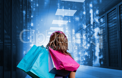 Girl with shopping bags looking at falling matrix