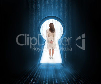 Businesswoman standing in keyhole doorway