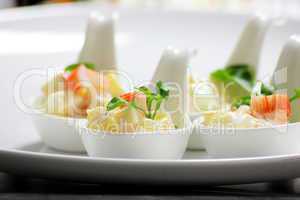 potato salad in white spoon